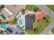 Aerial view of property showcasing a swimming pool, patio area, and lush landscaping in a desirable neighborhood at 8001 13Th S Ave, St Petersburg, FL 33707