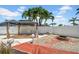 Relaxing outdoor area with a gazebo, fire pit, and well-maintained landscaping at 8001 13Th S Ave, St Petersburg, FL 33707