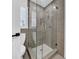 Modern bathroom featuring glass shower with hexagon tile floor and tiled walls at 8001 13Th S Ave, St Petersburg, FL 33707
