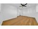 Bright bedroom with hardwood floors, large closets, and a ceiling fan at 8001 13Th S Ave, St Petersburg, FL 33707
