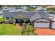 Charming single-story home featuring a well-manicured lawn and inviting curb appeal at 8001 13Th S Ave, St Petersburg, FL 33707