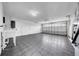 Spacious garage with rubber flooring, white walls and door to interior, and overhead door with windows at 8001 13Th S Ave, St Petersburg, FL 33707