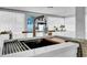 Close up of kitchen sink with quartz countertop and stainless steel sink with modern faucet at 8001 13Th S Ave, St Petersburg, FL 33707