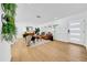 Spacious living room with modern furniture and hardwood flooring throughout the space at 8001 13Th S Ave, St Petersburg, FL 33707