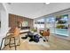 Bright living area includes breakfast bar, and view of fenced pool at 8001 13Th S Ave, St Petersburg, FL 33707