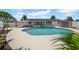 Enjoy the outdoors with a large pool surrounded by lush landscaping and privacy fencing at 8001 13Th S Ave, St Petersburg, FL 33707