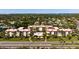 Spacious condominium complex with a well-maintained exterior, a swimming pool, and beautiful landscaping at 915 Beach Rd # 321, Sarasota, FL 34242
