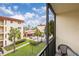 Balcony offering a view of the pool and beautifully maintained grounds at 915 Beach Rd # 321, Sarasota, FL 34242