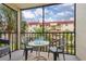 Relaxing balcony space with views of lush landscaping and nearby buildings at 915 Beach Rd # 321, Sarasota, FL 34242