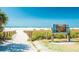 Pathway leading to the beach with Siesta Key advertising sign near the beach entrance at 915 Beach Rd # 321, Sarasota, FL 34242
