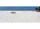 Expansive beach with volleyball nets and picnic tables on white sand at 915 Beach Rd # 321, Sarasota, FL 34242
