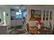 Dining area with lovely decor that opens to a quaint kitchen space at 915 Beach Rd # 321, Sarasota, FL 34242
