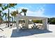 Picturesque picnic area featuring shaded tables and charcoal grills surrounded by trees and sand at 915 Beach Rd # 321, Sarasota, FL 34242