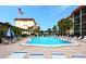 Inviting community pool with lounge chairs and well-maintained landscaping at 915 Beach Rd # 321, Sarasota, FL 34242
