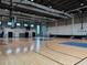 Full indoor basketball court at Skye Ranch with hoops and court markings at 9291 Starry Night Ave, Sarasota, FL 34241
