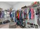 Walk-in closet with ample storage, shelving, and clothing racks for organization at 9291 Starry Night Ave, Sarasota, FL 34241