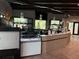 Stylish community coffee bar area with display cases and a modern counter at 9291 Starry Night Ave, Sarasota, FL 34241