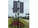 Community entrance showcasing the Skye Ranch signage with manicured landscaping and palm trees along the street at 9291 Starry Night Ave, Sarasota, FL 34241