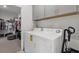 Well-equipped laundry room with washer, dryer, and ample storage space for convenience at 9291 Starry Night Ave, Sarasota, FL 34241
