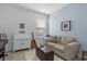 Welcoming space with comfortable seating, a desk, musical instrument, and a bright window at 9291 Starry Night Ave, Sarasota, FL 34241