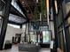Elegant lobby featuring soaring ceilings, modern decor, and natural light, creating a welcoming atmosphere at 9291 Starry Night Ave, Sarasota, FL 34241