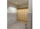 Locker room with wooden storage units and a sleek, modern design at 9291 Starry Night Ave, Sarasota, FL 34241
