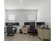 Bright office space with multiple monitors, desks, and comfortable gaming chairs setup at 9291 Starry Night Ave, Sarasota, FL 34241