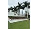 Sign for Skye Ranch Sarasota neighborhood lined by palm trees at 9291 Starry Night Ave, Sarasota, FL 34241