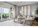 Stylishly designed living room featuring modern decor, comfortable seating, and a sliding door to a patio at 9994 Key Haven Rd, Seminole, FL 33777