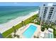 Aerial view showcasing the beach and the pool area at 1000 Longboat Club Road # 1105, Longboat Key, FL 34228