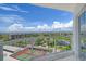 Enjoy spectacular views overlooking the golf course, tennis court, and ocean from the balcony at 1000 Longboat Club Road # 1105, Longboat Key, FL 34228