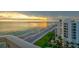 Stunning sunset over the ocean seen from a private balcony at 1000 Longboat Club Road # 1105, Longboat Key, FL 34228