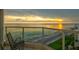 Relax on the balcony with breathtaking views of the ocean and coastline at 1000 Longboat Club Road # 1105, Longboat Key, FL 34228
