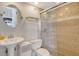 Neat bathroom with glass door shower, updated fixtures, and tiled walls at 1000 Longboat Club Road # 1105, Longboat Key, FL 34228