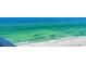 Breathtaking view of the beach and ocean from a high-rise balcony at 1000 Longboat Club Road # 1105, Longboat Key, FL 34228