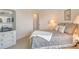 Cozy bedroom with built-in shelving, stylish decor, and a comfortable bed at 1000 Longboat Club Road # 1105, Longboat Key, FL 34228