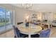 Open-concept floor plan with a spacious living room, dining area, and sliding doors to the balcony at 1000 Longboat Club Road # 1105, Longboat Key, FL 34228