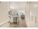 Bright and airy entryway with a glimpse of the open-concept living area and scenic views at 1000 Longboat Club Road # 1105, Longboat Key, FL 34228