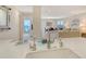Bright living area with kitchen sink and views of the ocean beyond at 1000 Longboat Club Road # 1105, Longboat Key, FL 34228