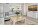 Inviting living room with a modern kitchen, comfortable seating, and tasteful decor at 1000 Longboat Club Road # 1105, Longboat Key, FL 34228