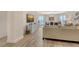 Spacious living room with hardwood flooring and panoramic views of the ocean and balcony at 1000 Longboat Club Road # 1105, Longboat Key, FL 34228