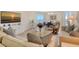 This open-concept living room features a serene ocean view and comfortable, neutral decor at 1000 Longboat Club Road # 1105, Longboat Key, FL 34228