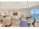 Sun-filled living space boasts an open layout, hardwood floors, balcony access, and serene views at 1000 Longboat Club Road # 1105, Longboat Key, FL 34228