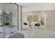 Modern lobby with marble floors, seating area, and reception desk, creating an inviting atmosphere at 1000 Longboat Club Road # 1105, Longboat Key, FL 34228