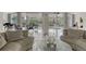 Inviting lobby with comfortable seating, modern decor, and a view of the landscaped entrance at 1000 Longboat Club Road # 1105, Longboat Key, FL 34228