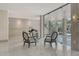 Sophisticated lobby with elegant chairs, grand piano, and marble floors, showcasing luxury and style at 1000 Longboat Club Road # 1105, Longboat Key, FL 34228