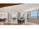 A well lit lounge area is perfect for socializing with tables and seating available plus ocean views at 1000 Longboat Club Road # 1105, Longboat Key, FL 34228