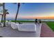 Modern patio with seating areas and grills overlooking the ocean at 1000 Longboat Club Road # 1105, Longboat Key, FL 34228