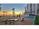 Beautiful pool area with hot tub, shuffleboard and beach access at sunset at 1000 Longboat Club Road # 1105, Longboat Key, FL 34228
