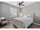 Bedroom with neutral walls and a ceiling fan, creating a serene and inviting space for relaxation and rest at 11550 Blackfin St, Venice, FL 34292